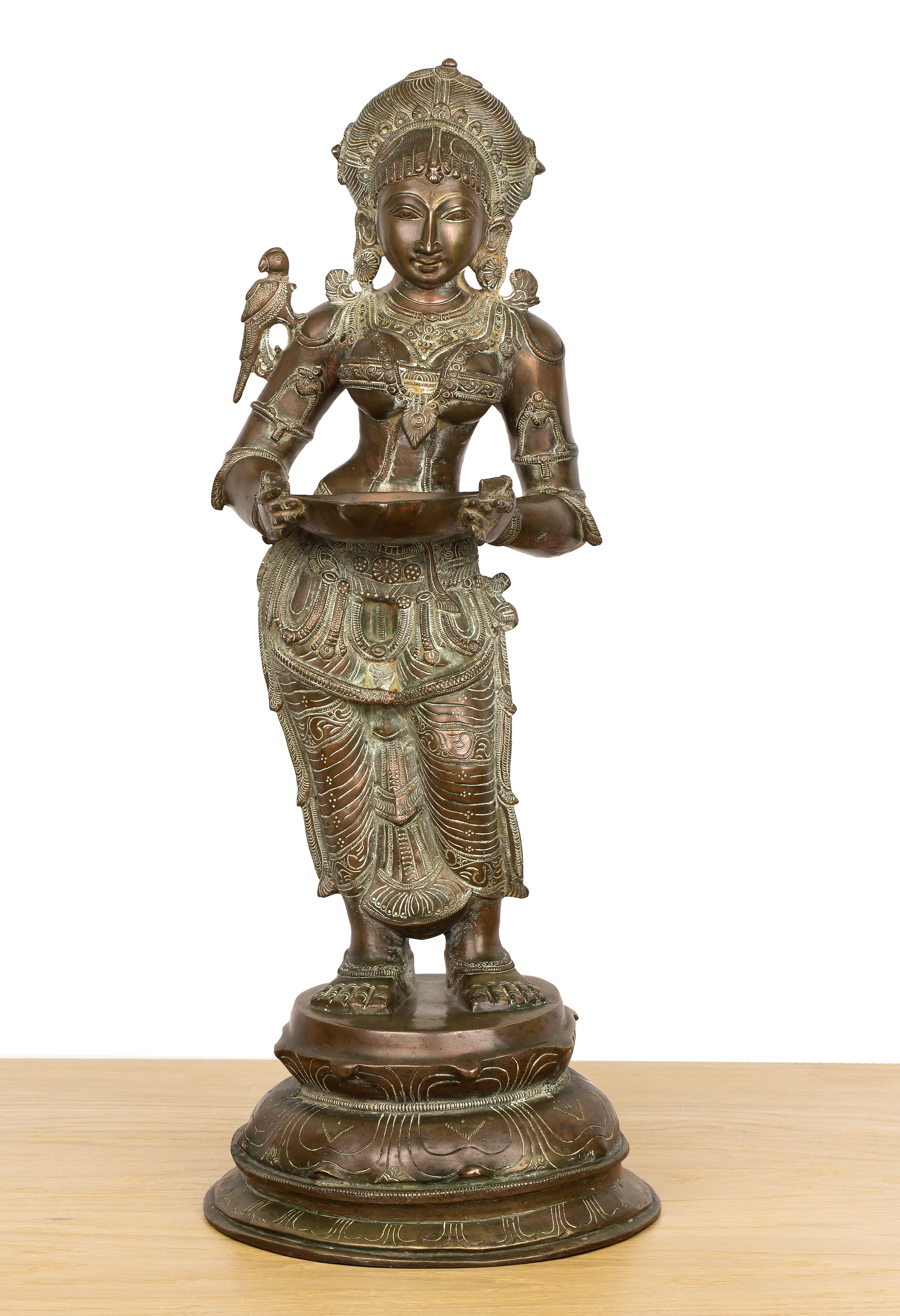 Bronze Lakshmi figure Indian with finely engraved decorated throughout, the goddess holds a dish