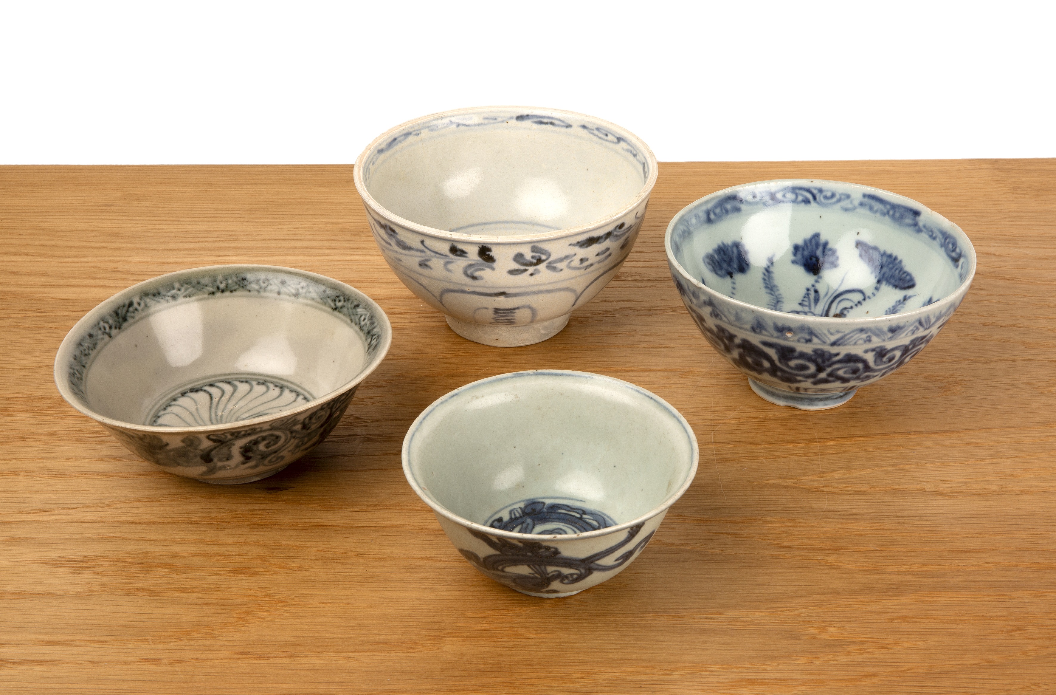 Group of four blue and white bowls Chinese, 16th Century to include a Makara pattern bowl, 15cm, a