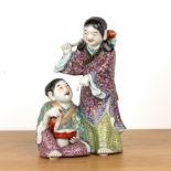 Porcelain mother and child group Chinese, 20th Century painted in polychrome enamels. The mother