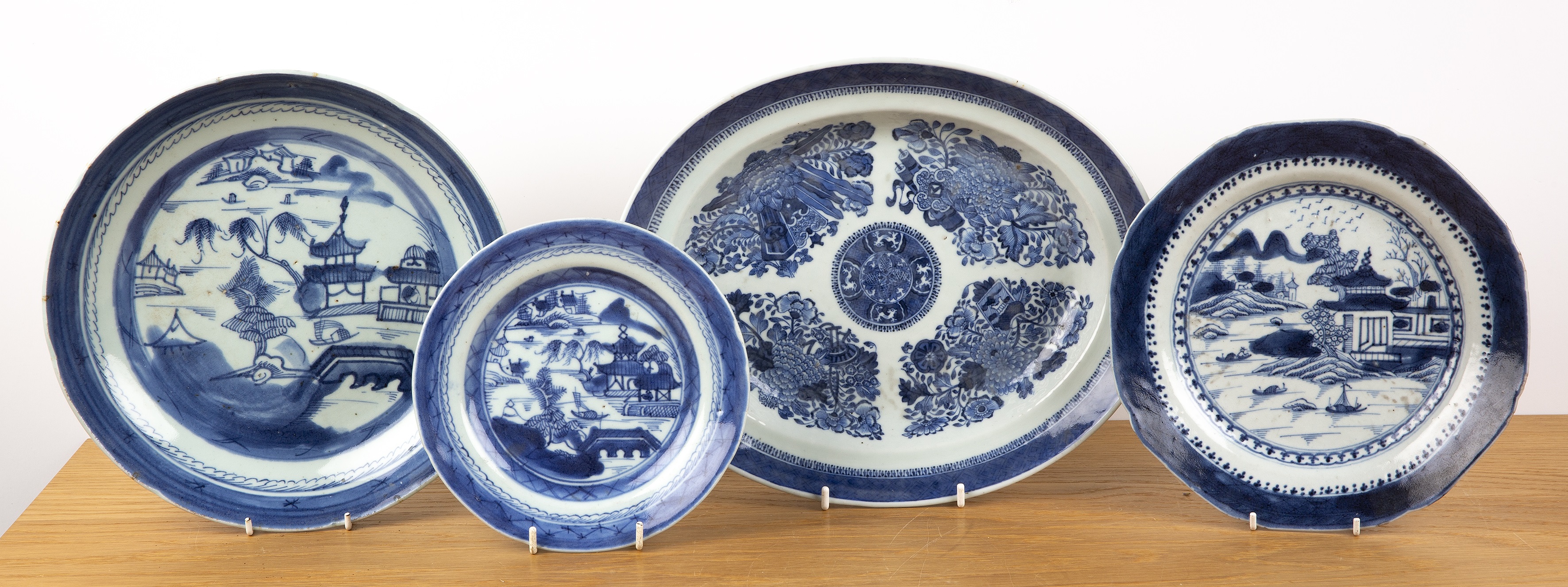 Four Chinese blue and white plates Chinese, 19th Century including an oval small Fitzhugh pattern