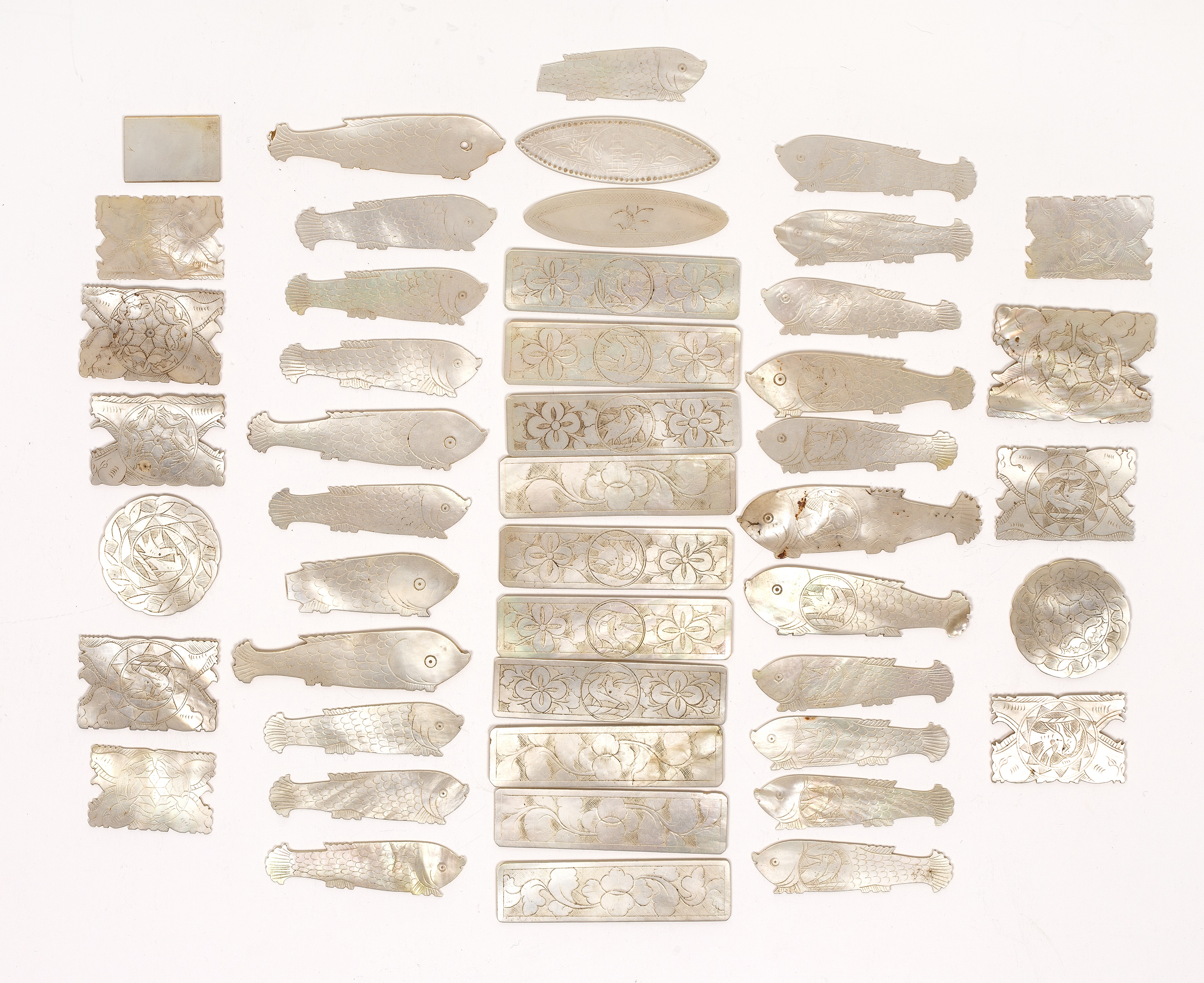 Collection of mother-of-pearl gaming tokens 19th Century, Chinese with engraved decoration of