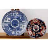 Two Imari circular chargers Japanese including a polychrome dish with a central vase of flowers,