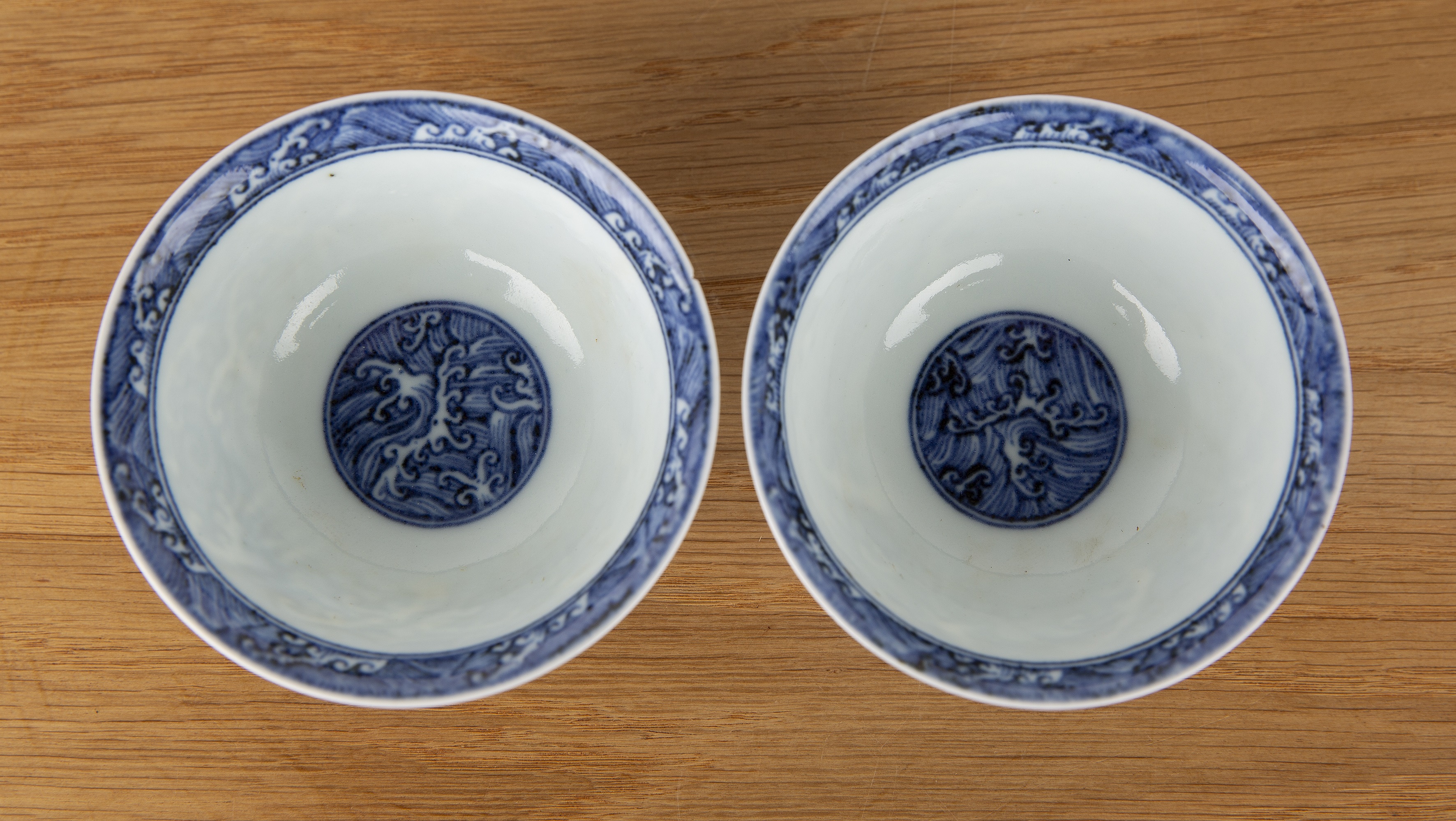 Pair of blue wave pattern bowls Chinese, 19th Century each on a raised foot with a single band, 10cm - Image 2 of 8