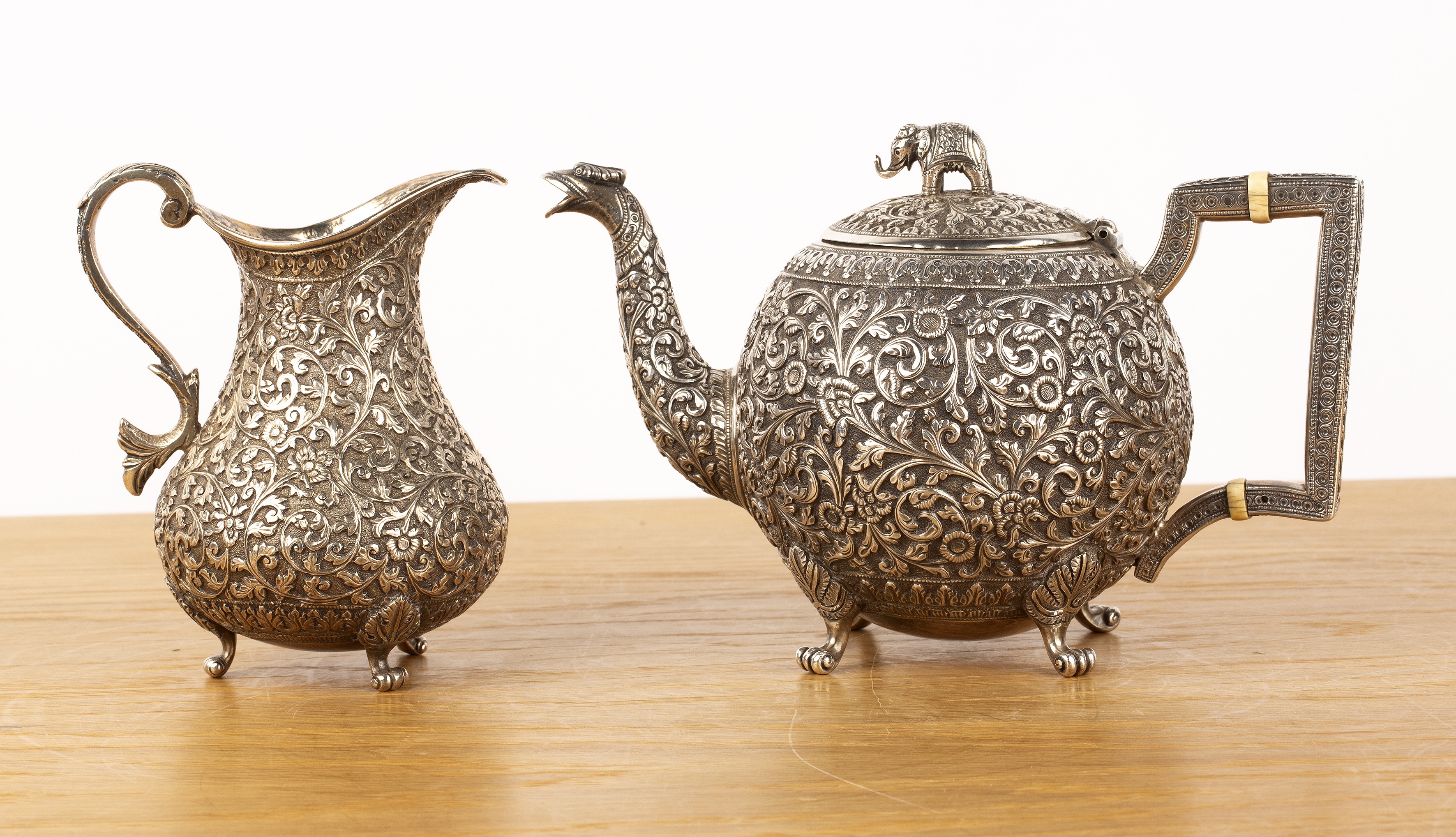 Indian Cutch teapot and similar jug late 19th Century both with chased detail throughout with - Image 2 of 4