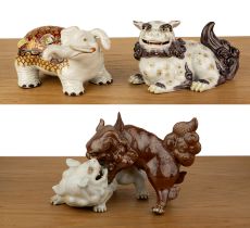Three porcelain models of animals Japanese, 19th Century to include two fighting kylins, 25cm, model