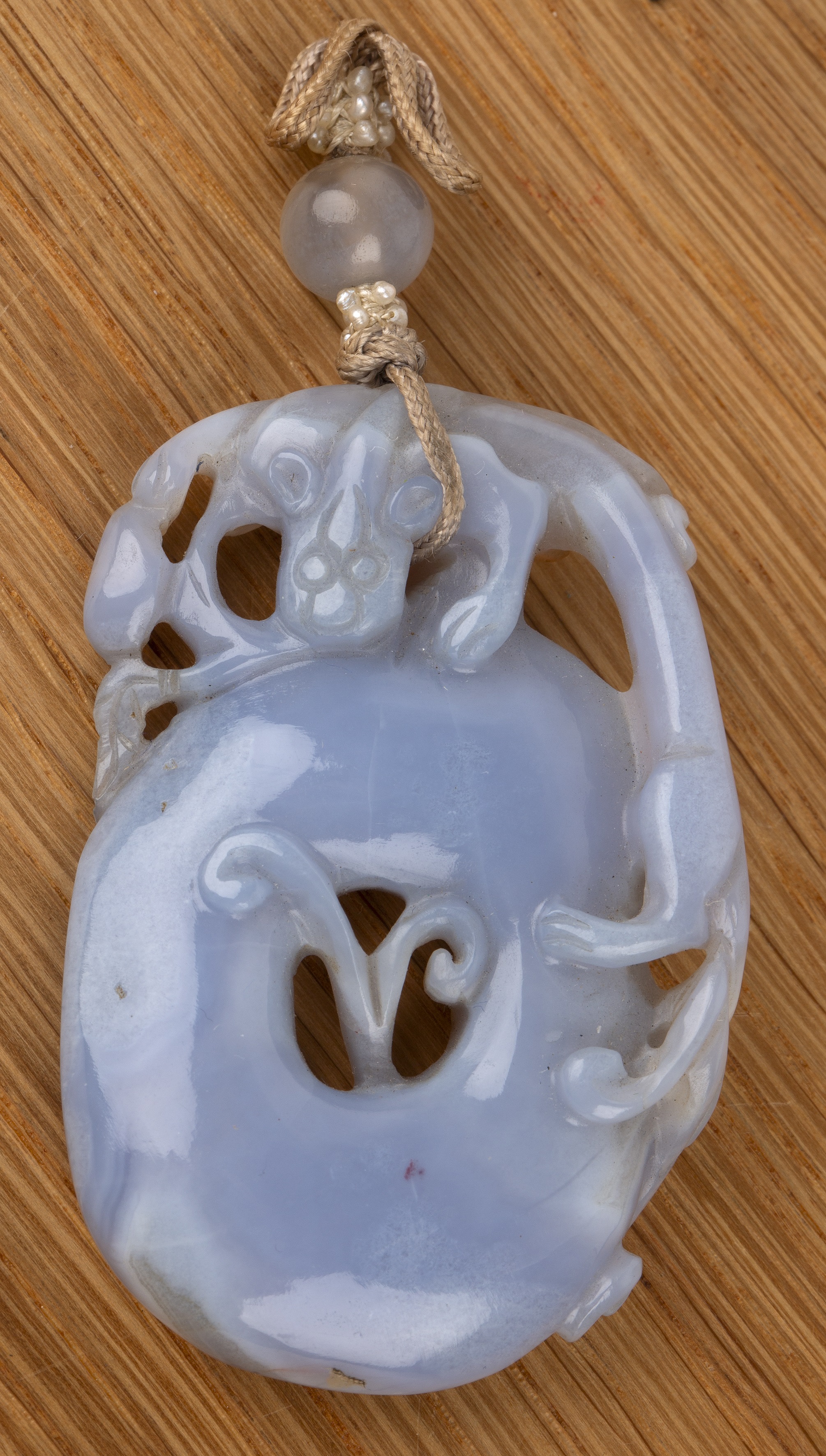 Amber kylin seal Chinese, 19th Century mounted on a metal and glass oval base, with a puppy on its - Image 3 of 13