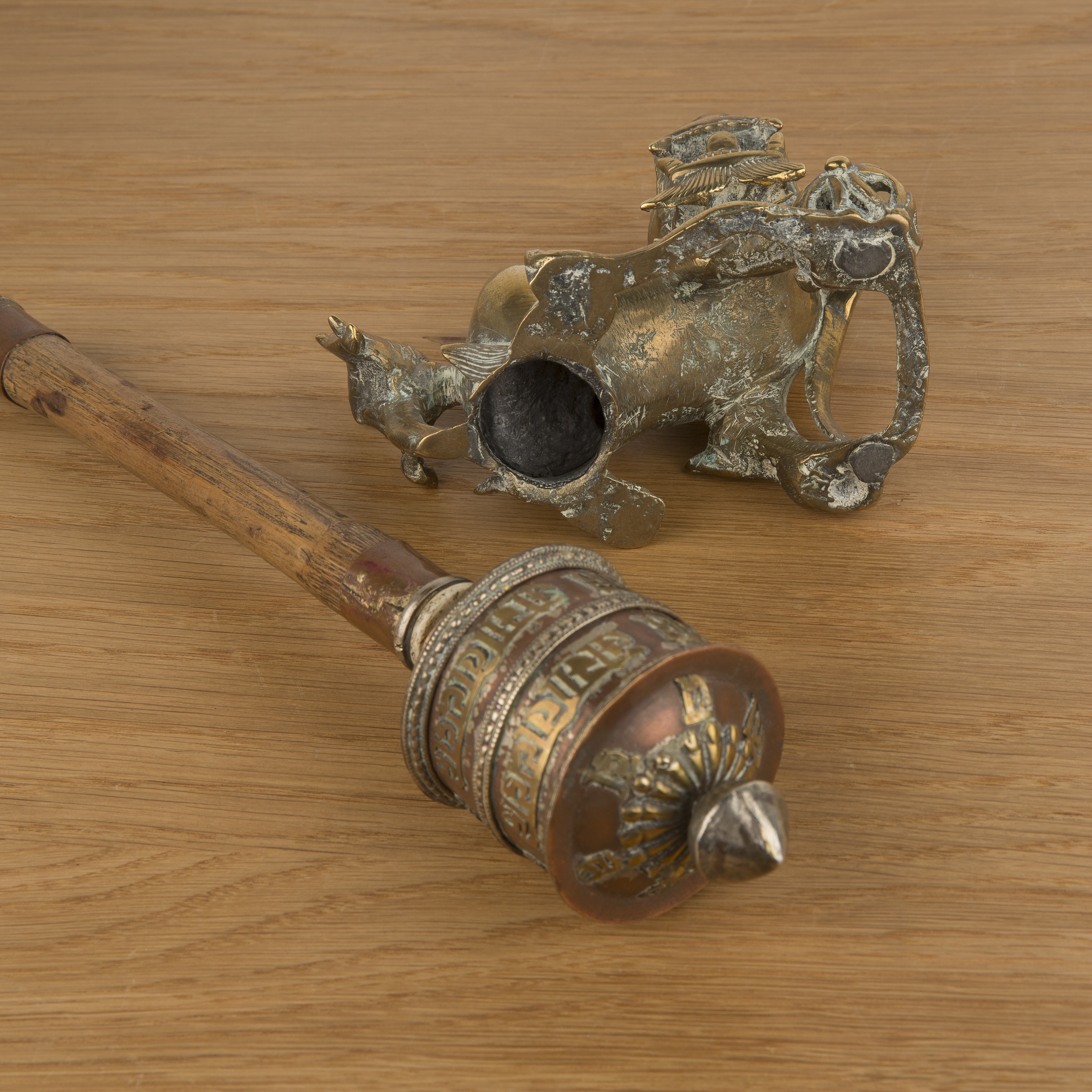 Prayer wheel and a brass temple dog Tibetan and Chinese the wheel with a bamboo handle, 29cm and - Image 3 of 3