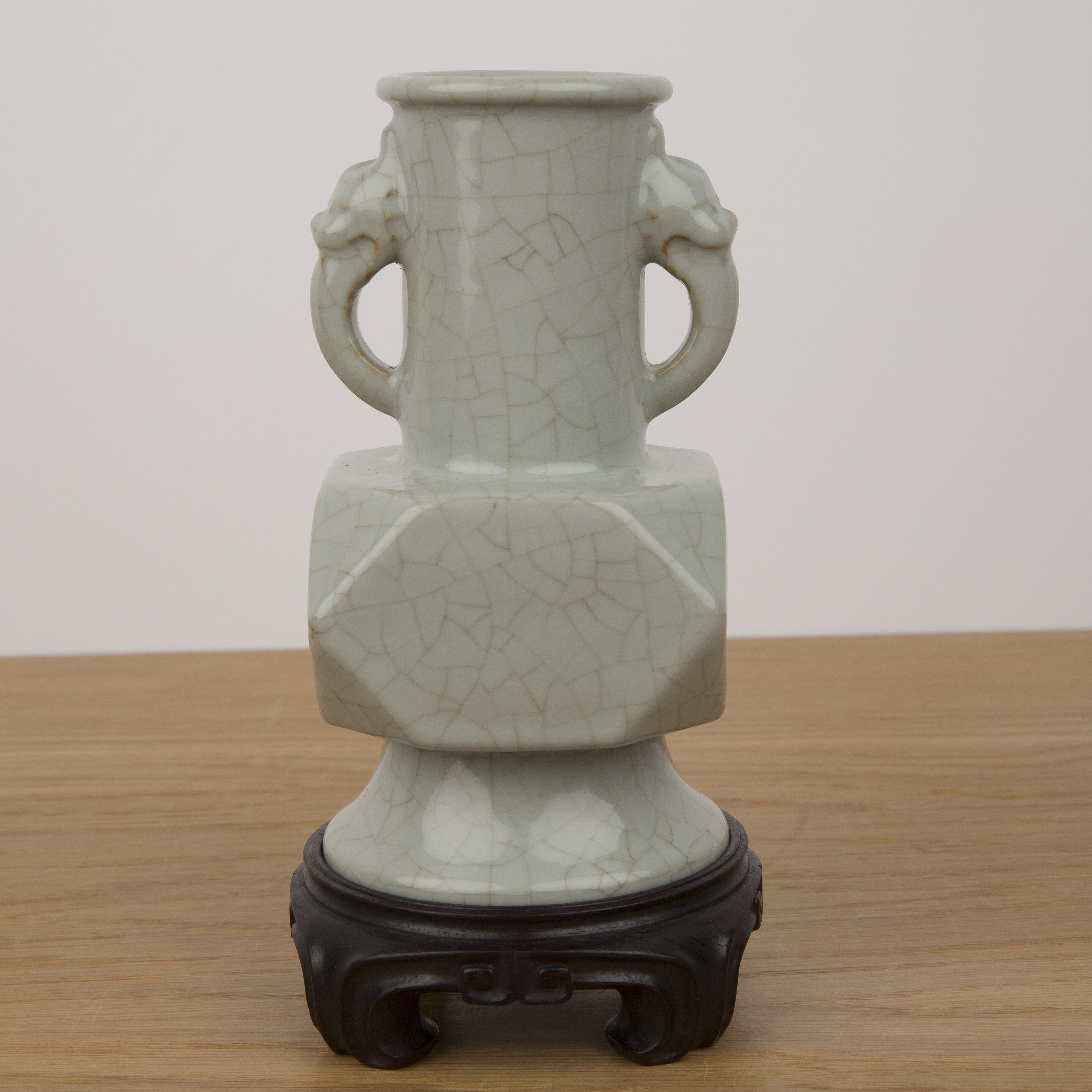 Archaic bronze form celadon vase Chinese with mask head handles, crackle glaze, and canted body - Image 2 of 17