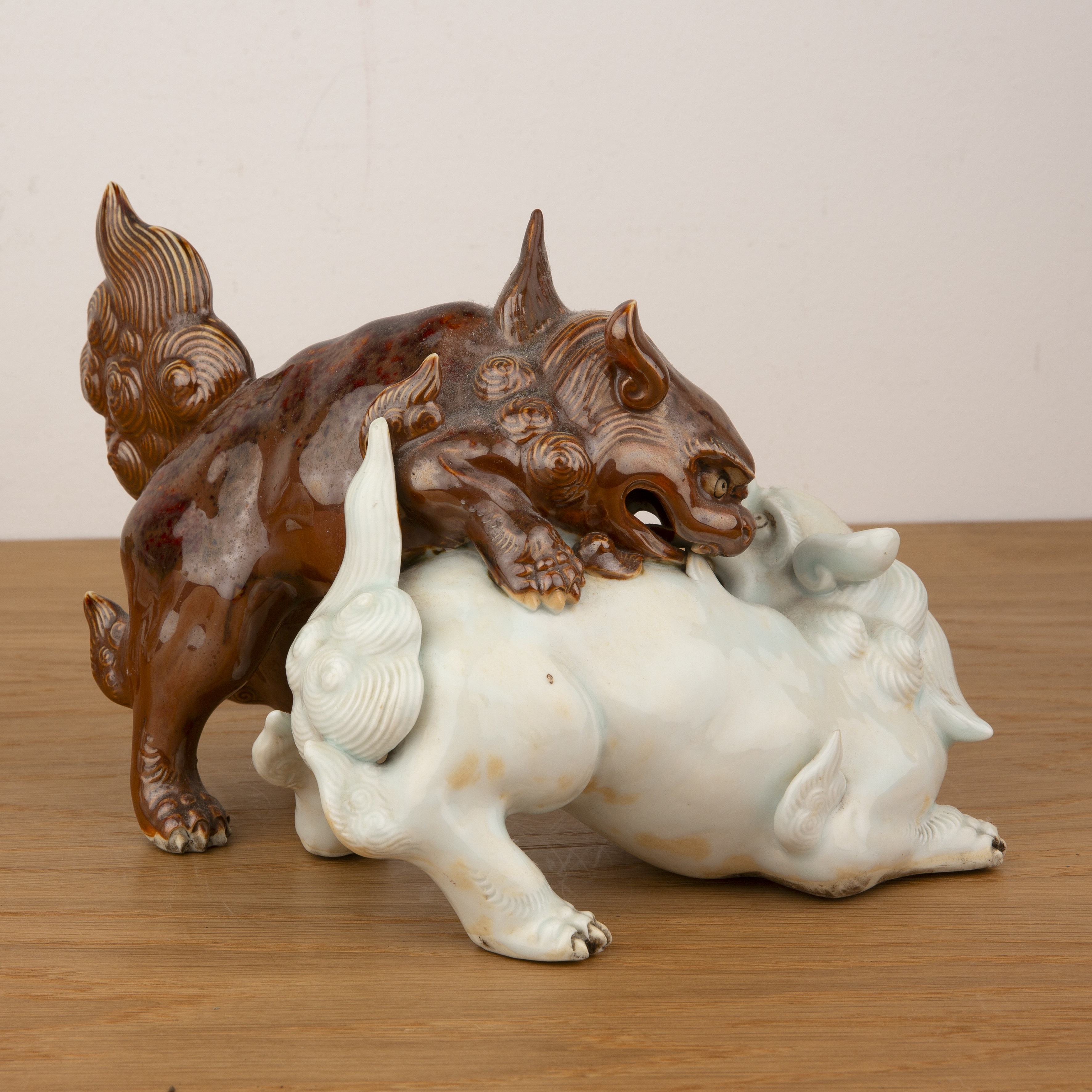 Three porcelain models of animals Japanese, 19th Century to include two fighting kylins, 25cm, model - Image 4 of 8