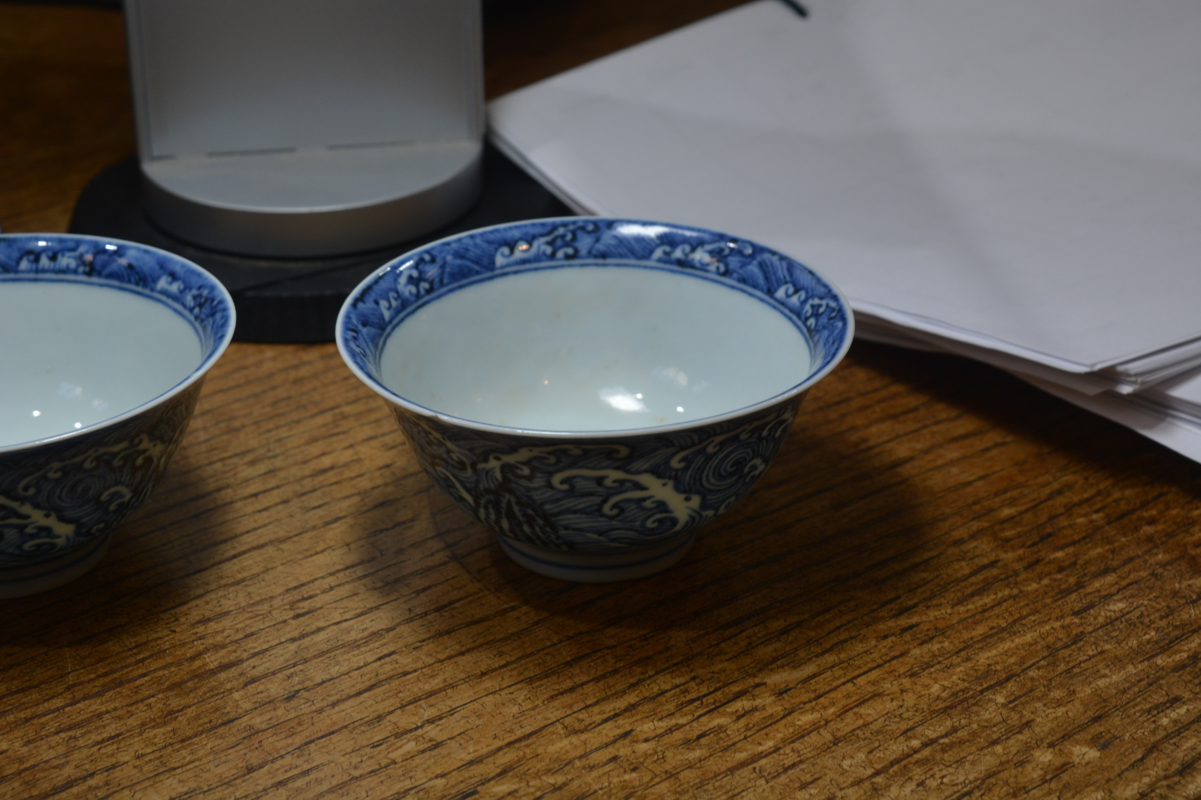 Pair of blue wave pattern bowls Chinese, 19th Century each on a raised foot with a single band, 10cm - Image 6 of 8