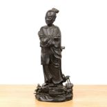 Bronze standing figure of a Taoist monk Chinese, Ming period the serene standing robed figure with