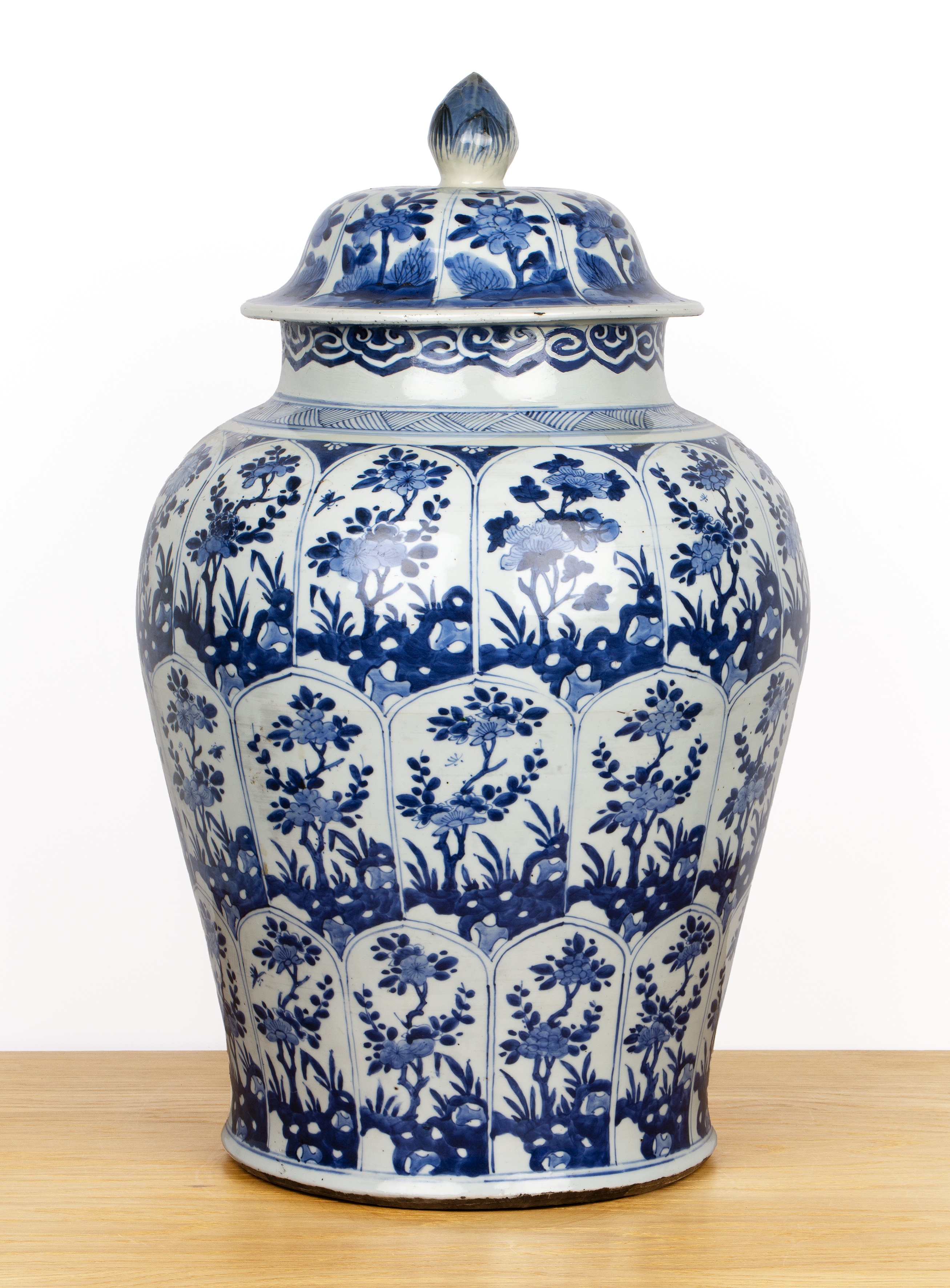 Blue and white jar and cover Chinese, Kangxi with all-over panels of flowers, within a chevron and