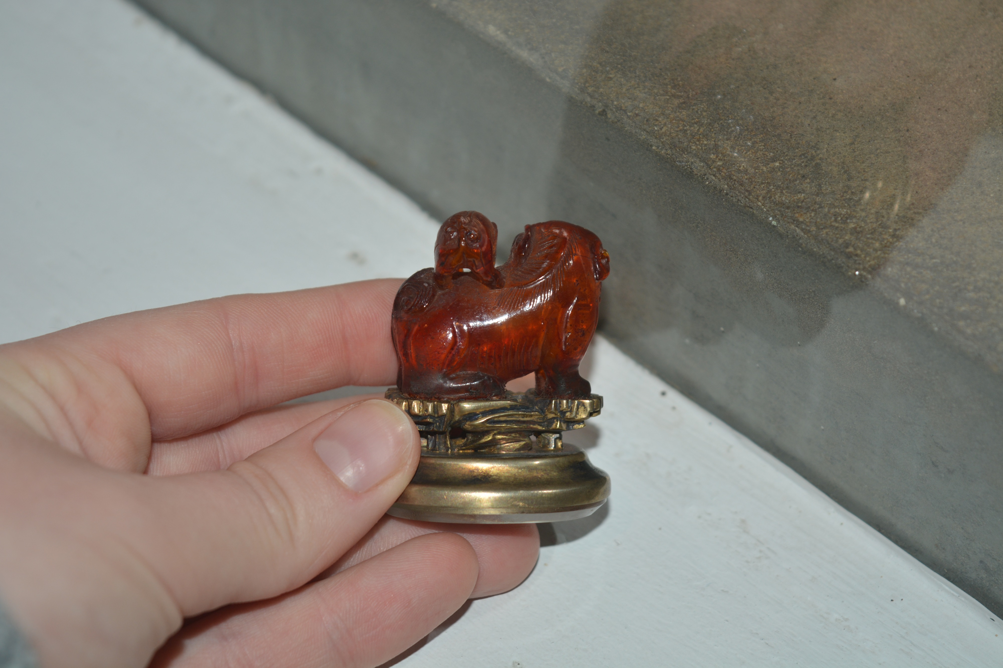 Amber kylin seal Chinese, 19th Century mounted on a metal and glass oval base, with a puppy on its - Image 9 of 13