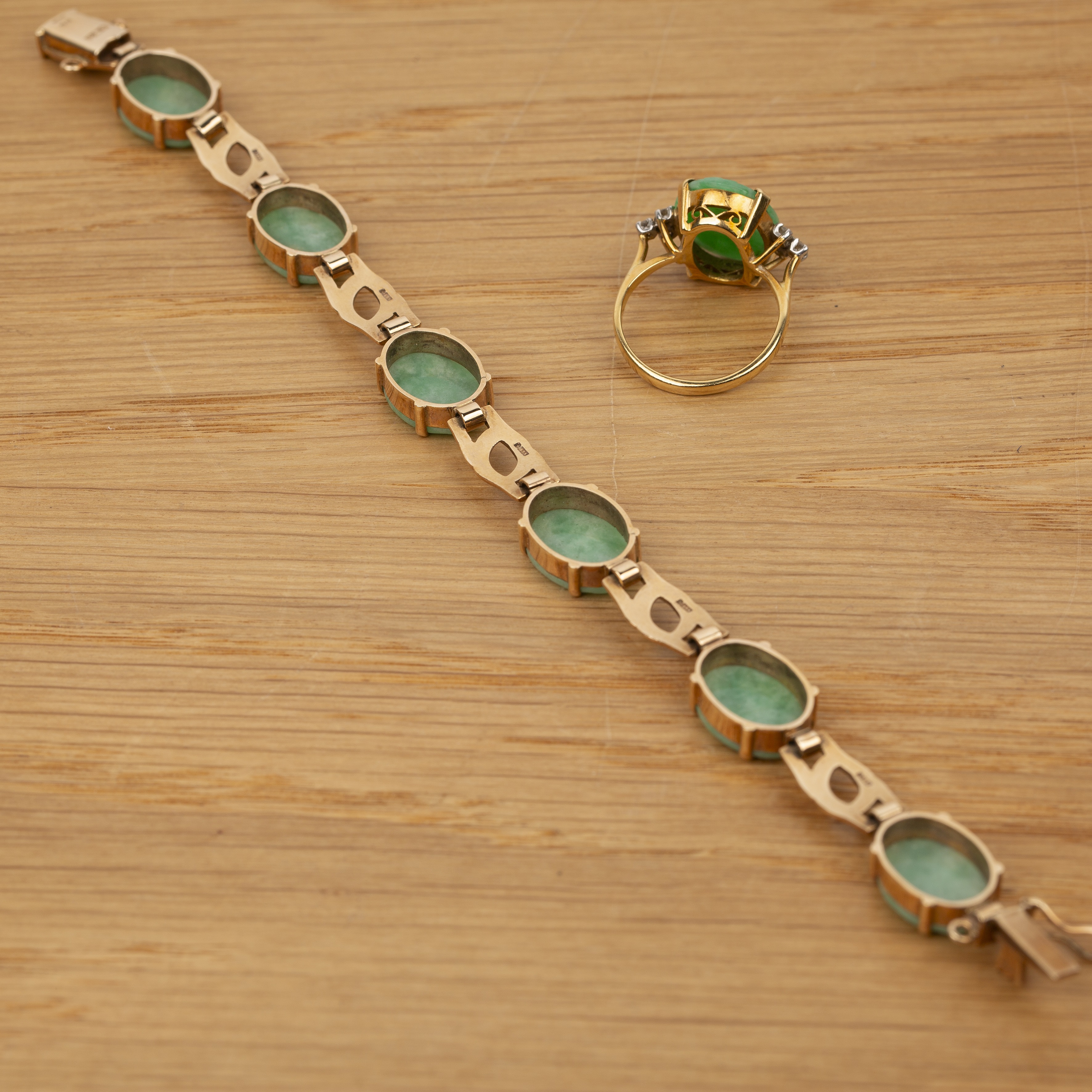 Two pieces of jade jewellery English, 20th Century the first a 9ct gold panel bracelet, set with six - Image 4 of 4