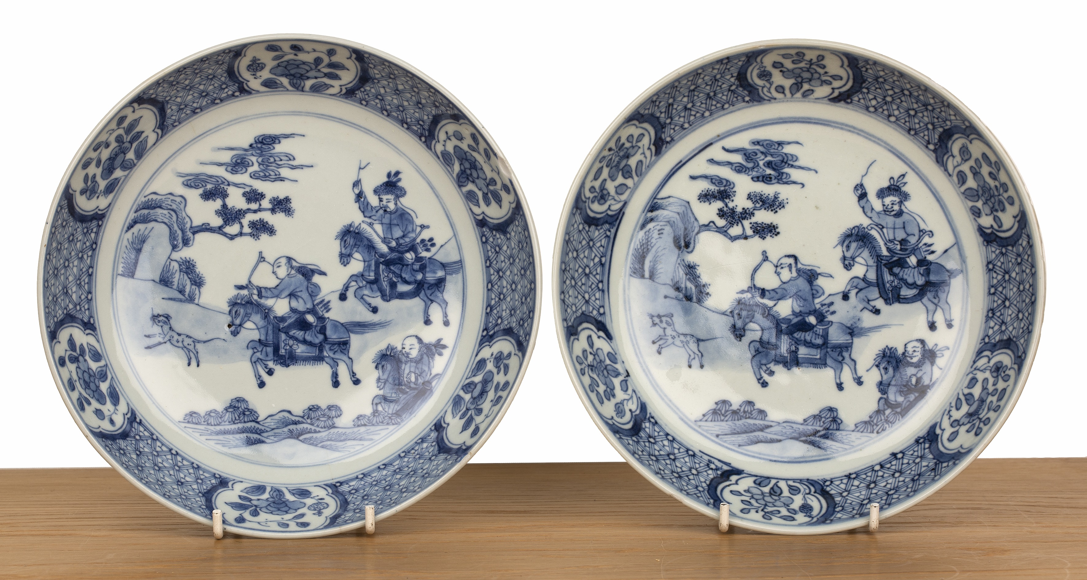 Pair of blue and white porcelain shallow dishes Chinese, Kangxi each painted with hunting scenes