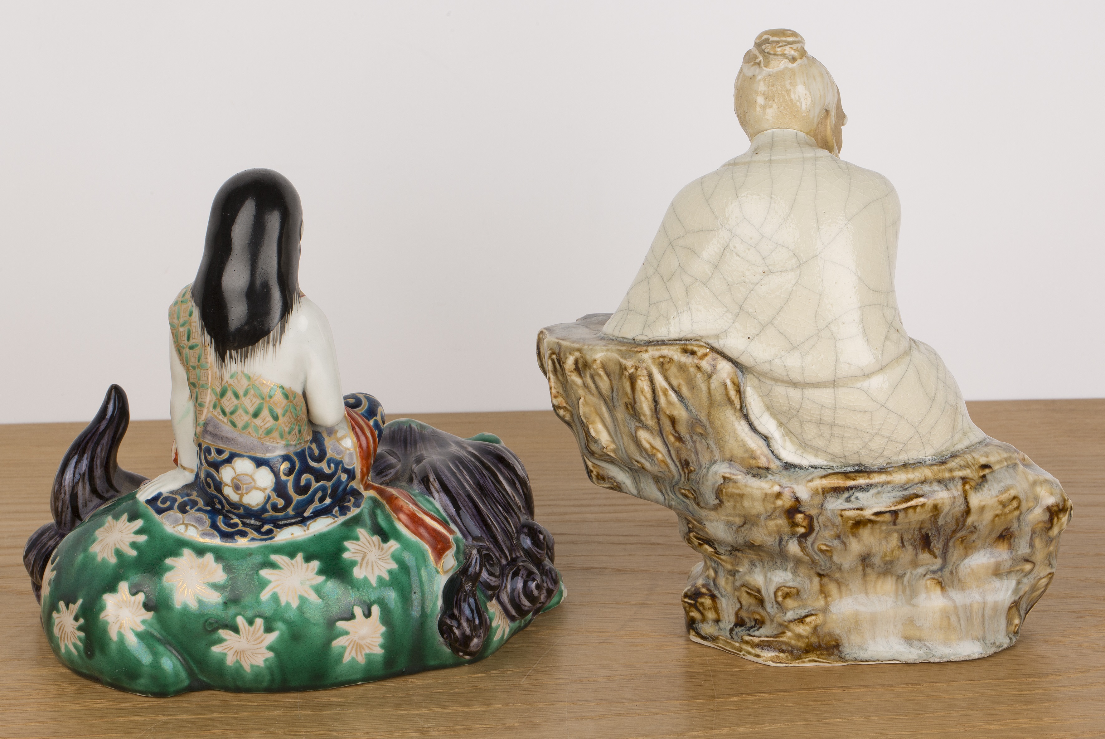 Two porcelain figures Chinese and Japanese including a seated Shiwan glazed scholar leaning - Image 2 of 4