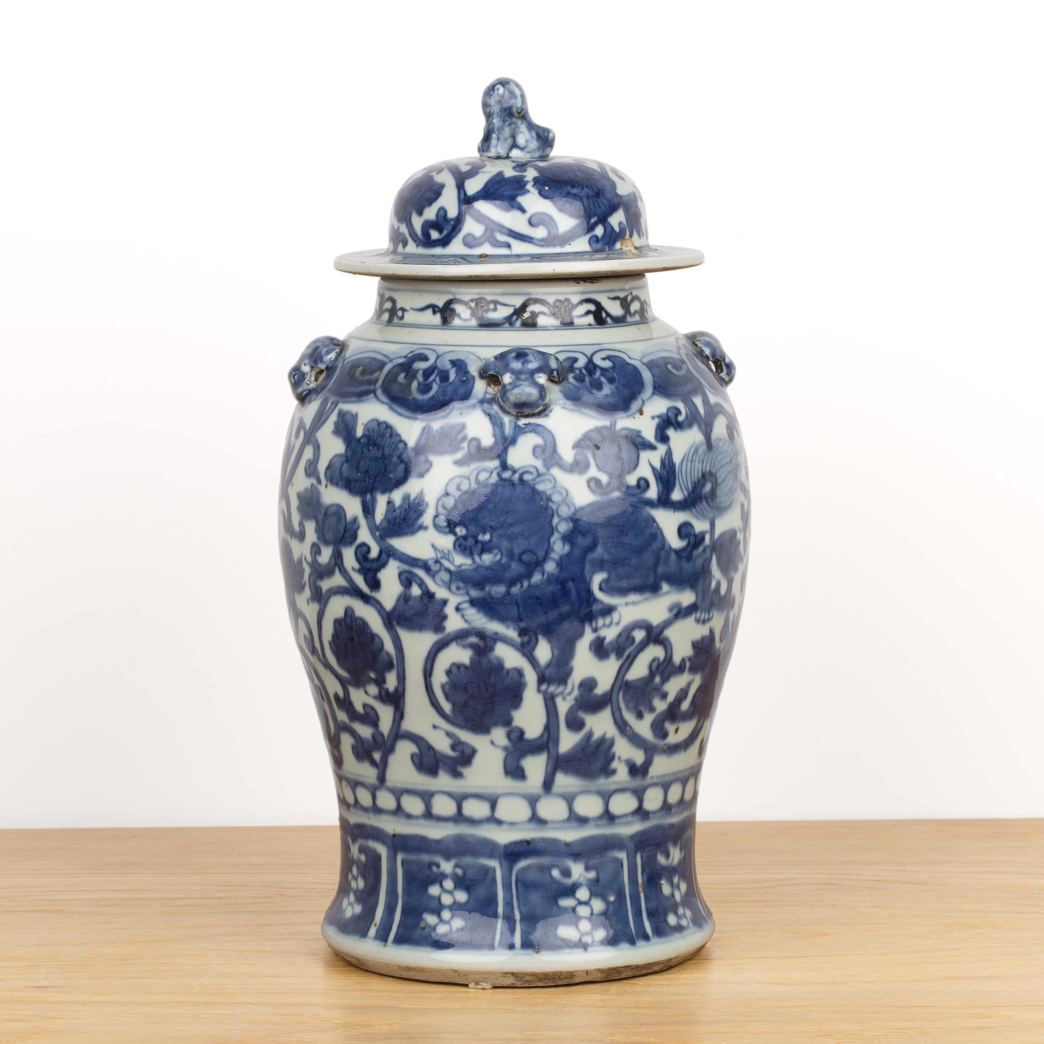 Blue and white vase and cover Chinese, 19th Century painted with trailing lotus flowers and with lug