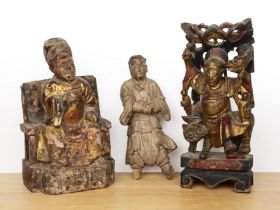 Three carved wooden figures Chinese including a seated Emperor, 35cm high, a red lacquer and