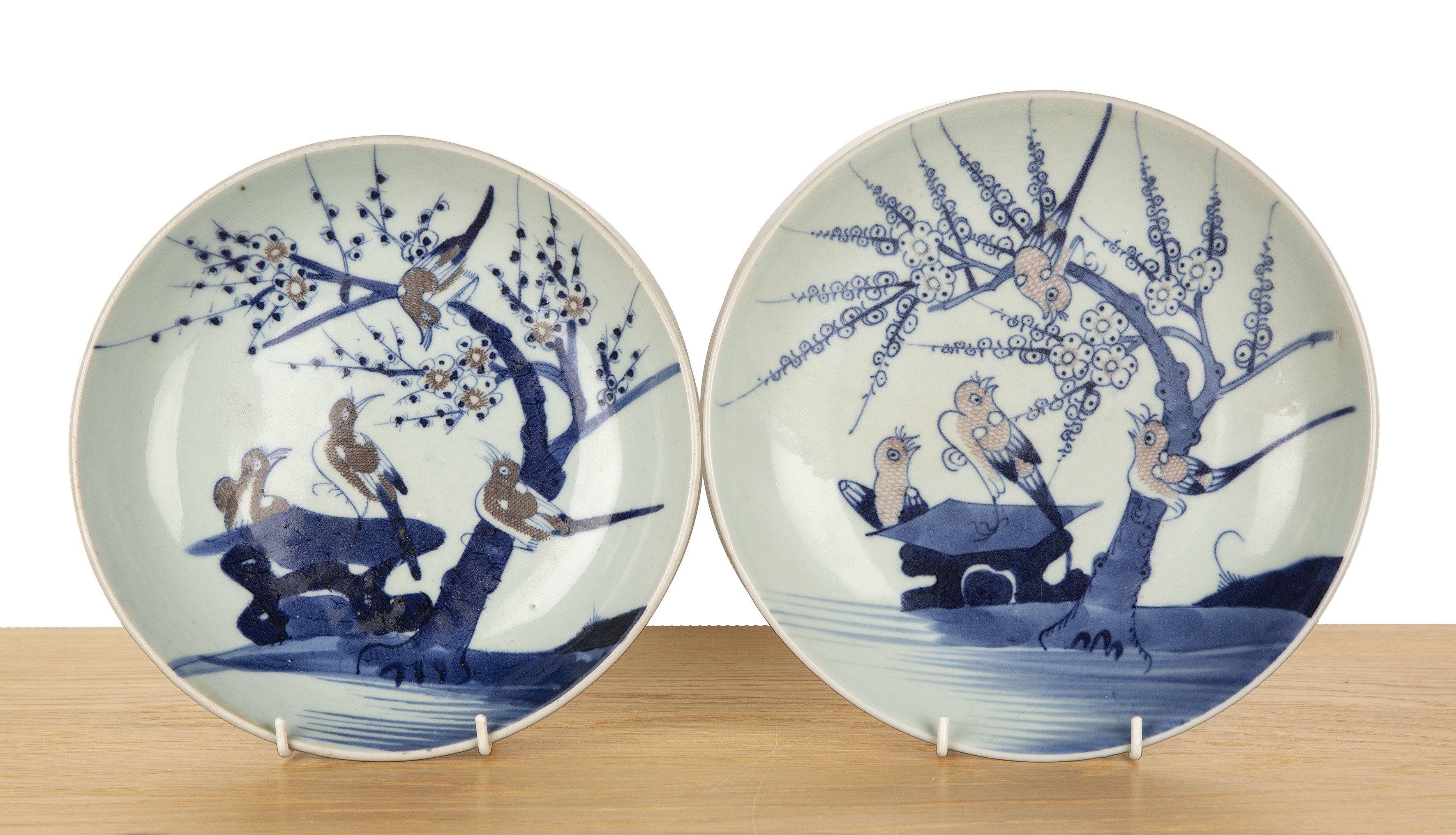 Two porcelain shallow dishes Chinese, 19th Century each painted with birds and blossom, 23cm and