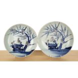 Two porcelain shallow dishes Chinese, 19th Century each painted with birds and blossom, 23cm and
