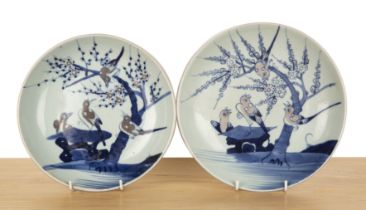 Two porcelain shallow dishes Chinese, 19th Century each painted with birds and blossom, 23cm and