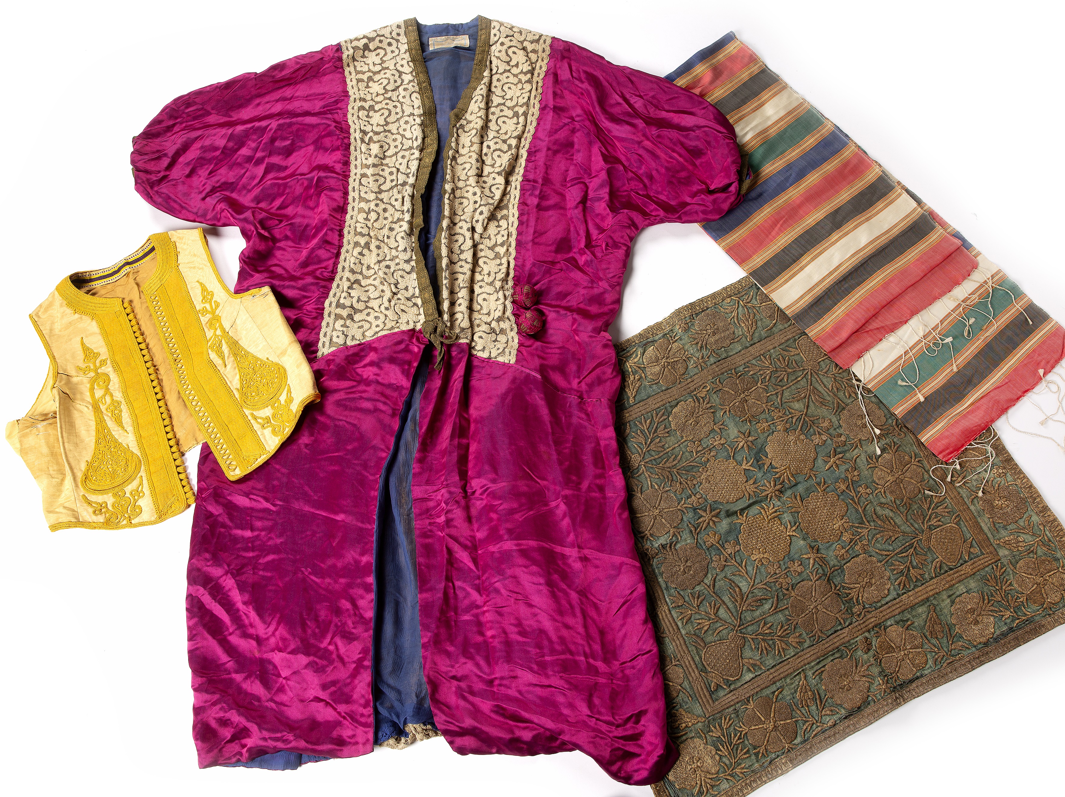 Small group of Ottoman textiles Turkish including an embroidered panel, waistcoat and other