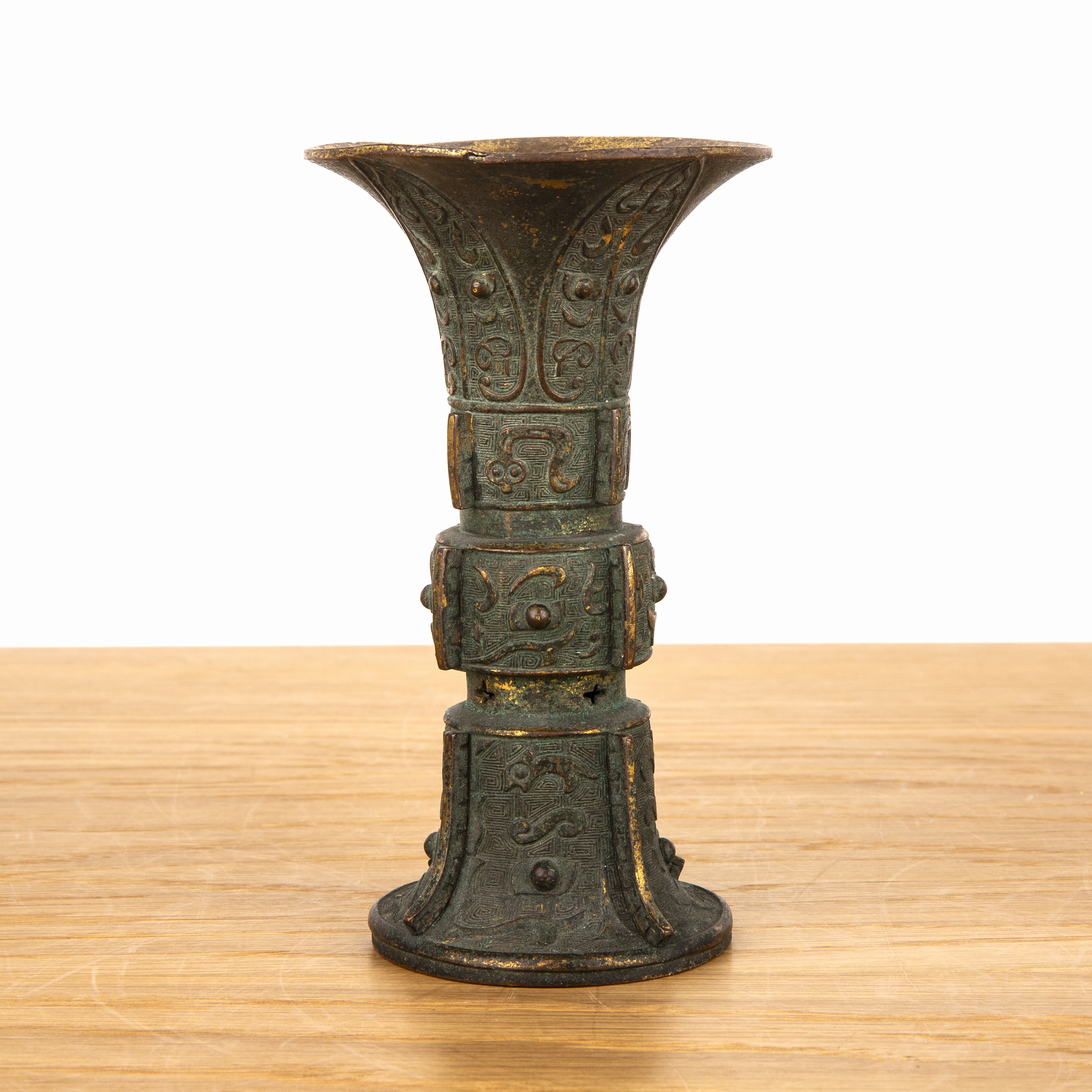 Gilt copper archaic form Gu form vessel Chinese, 17th/18th Century with taotie raised decoration, - Image 2 of 4