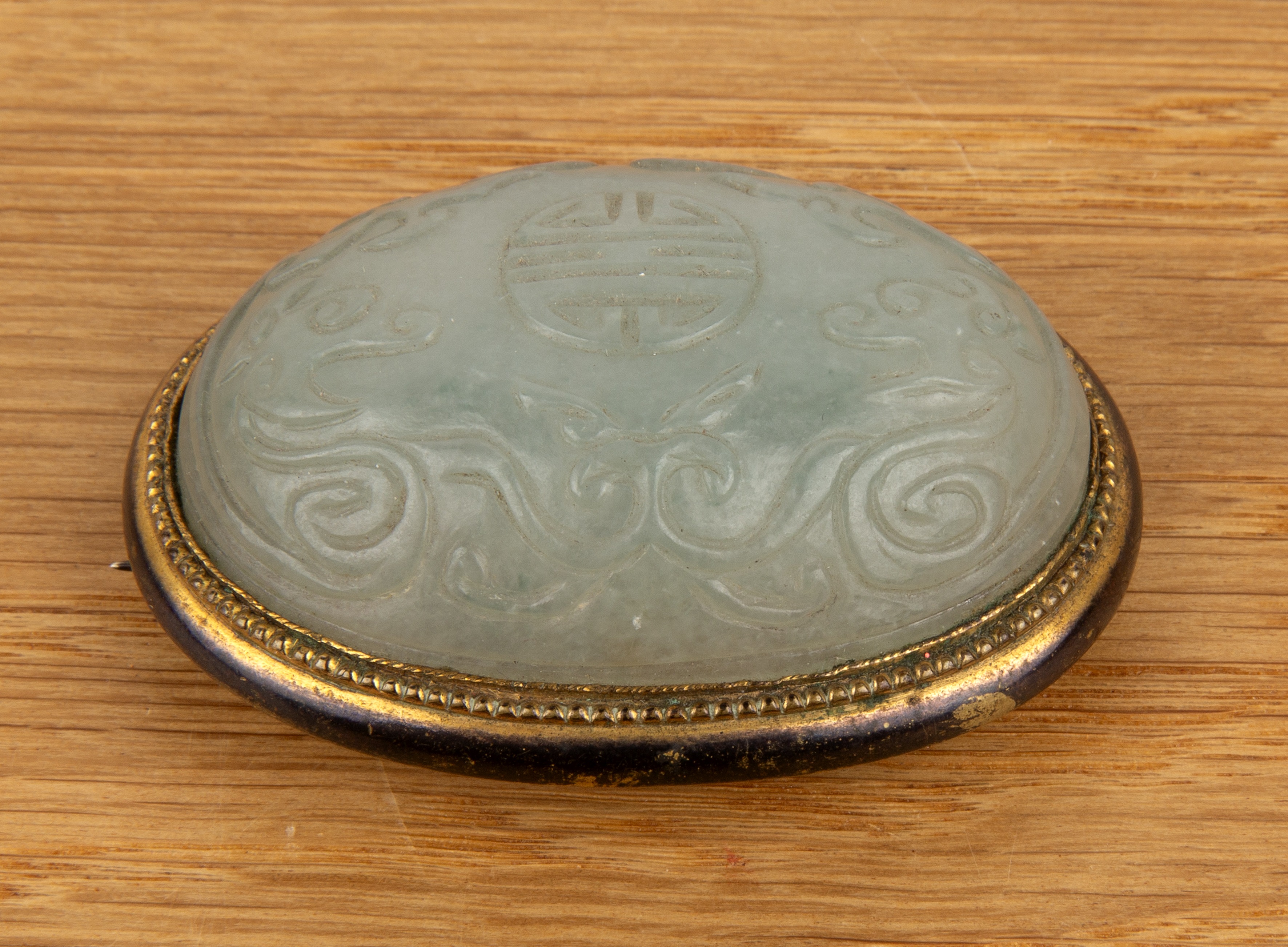 Large pale green oval mounted jade brooch Chinese, 18th/19th Century carved with a central shou - Image 2 of 3