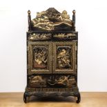 Black lacquer cabinet on stand Japanese the piece with two central doors, the doors opening to