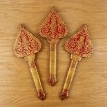 Painted red and gold lacquer hand fans Thailand of palm leaf form with a central painted buddha,