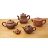 Group of five Yixing teapots Chinese, 19th/20th Century to include a rectangular teapot with moulded