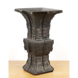 Large bronze archaic Gu form vessel Chinese, 19th Century with raised bands, and panels of taotie