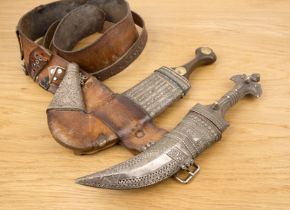 Two jambiyas Yemeni each with an engraved silver metal scabbard, and one with a leather belt. Both