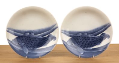 Pair of blue and white porcelain plates Japanese, 19th Century painted with carp, 21.2cm diameter (