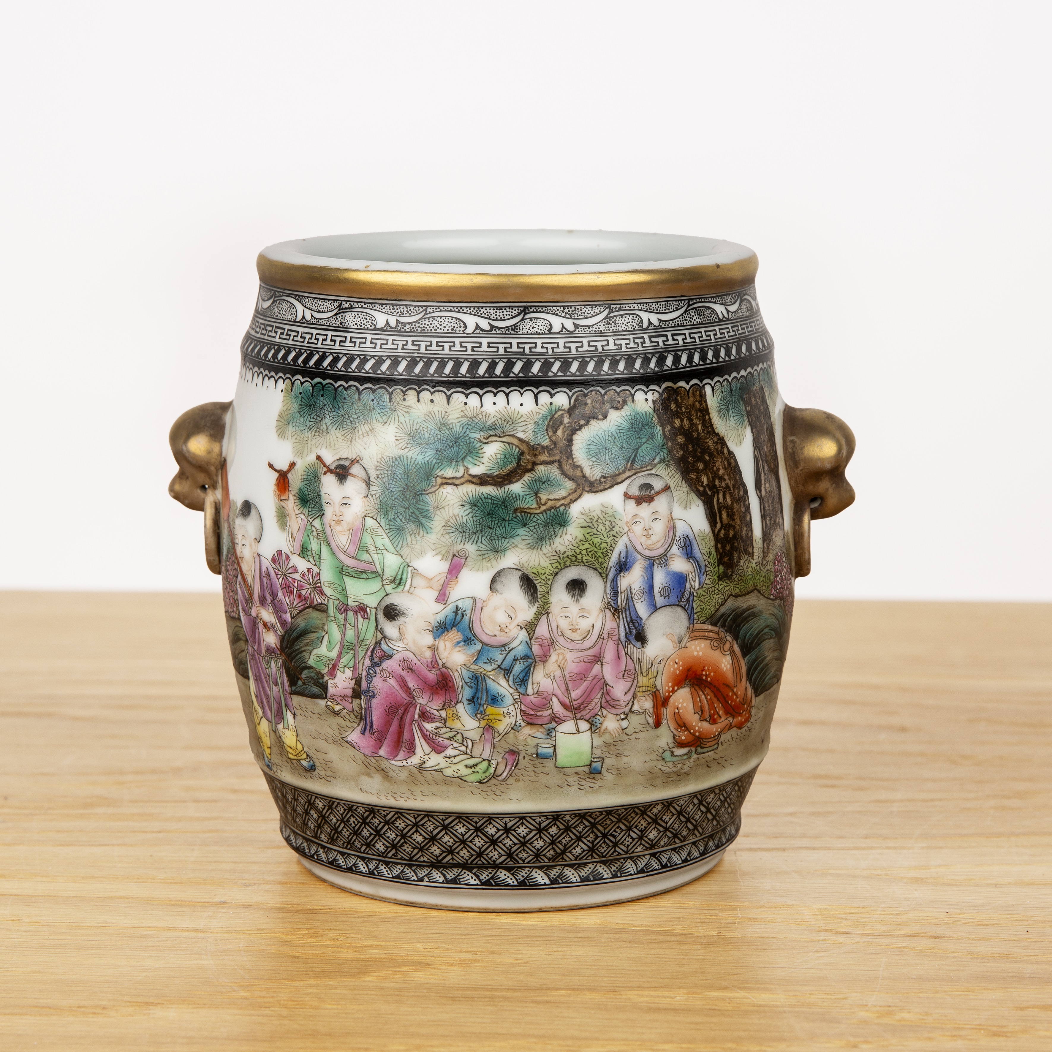 Porcelain barrel vase Chinese, Republic or later with a painted garden scene of children painting