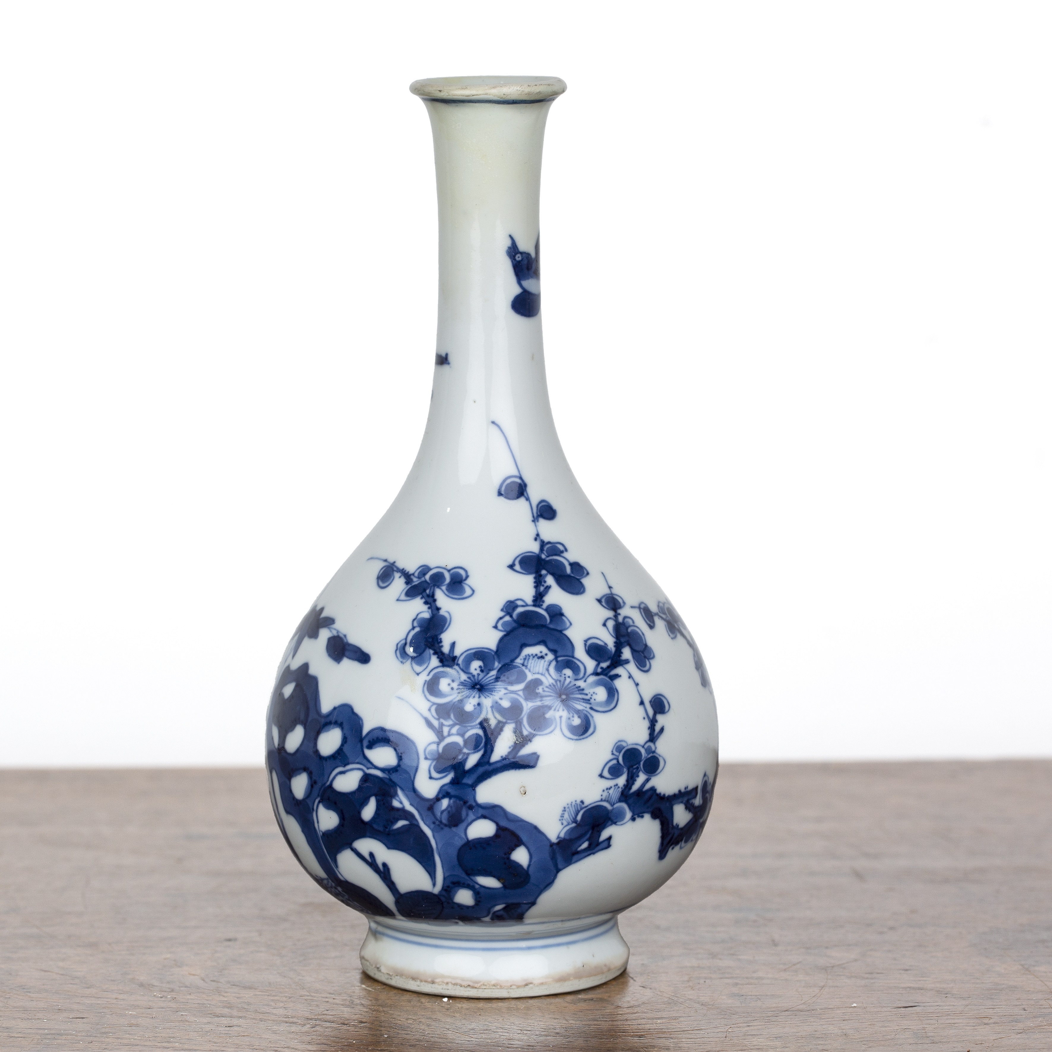 Blue and white porcelain bottle vase Chinese, Kangxi painted with branches, rockwork and blossom,