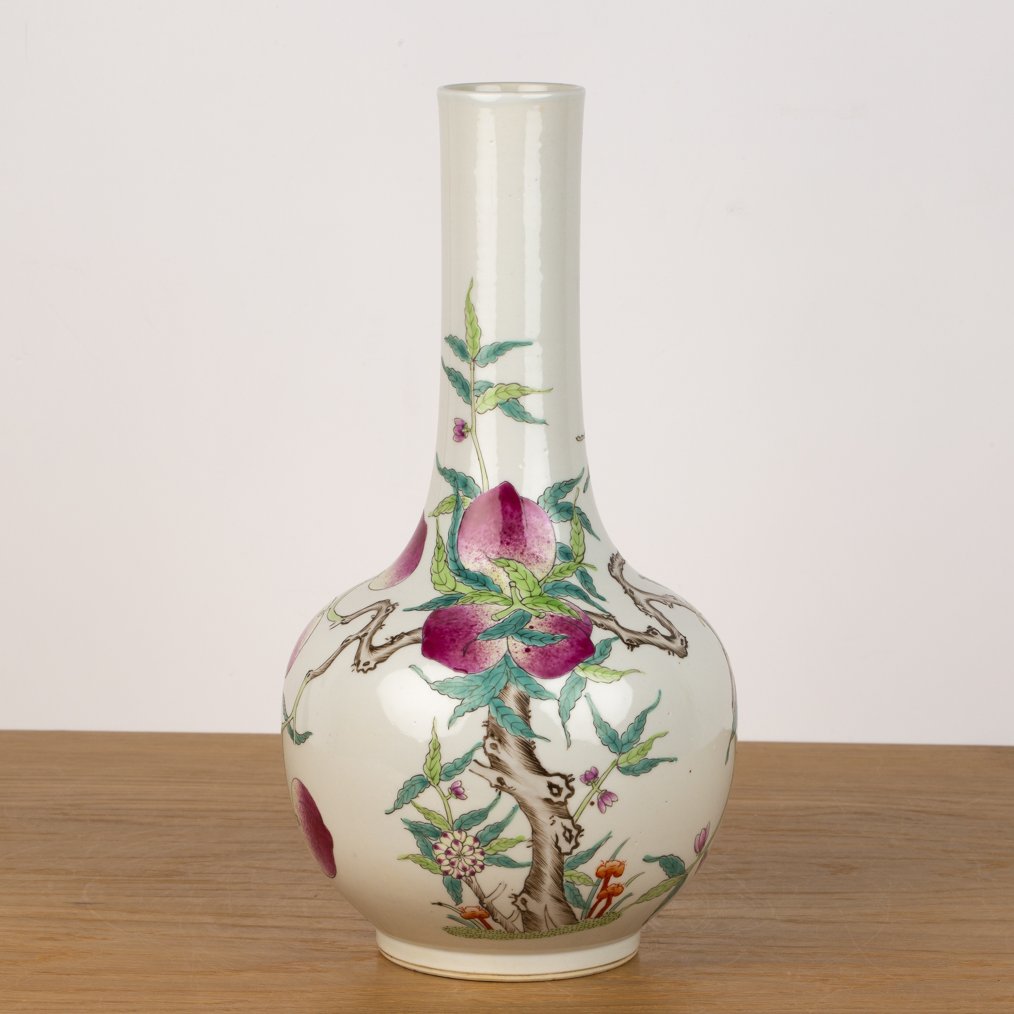 Peach decorated bottle vase Chinese, 20th Century with enamelled decoration, 36cm high With some
