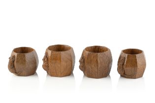 Robert Thompson of Kilburn (1876-1955) A set of four Mouseman napkin rings, circa 1970 oak carved