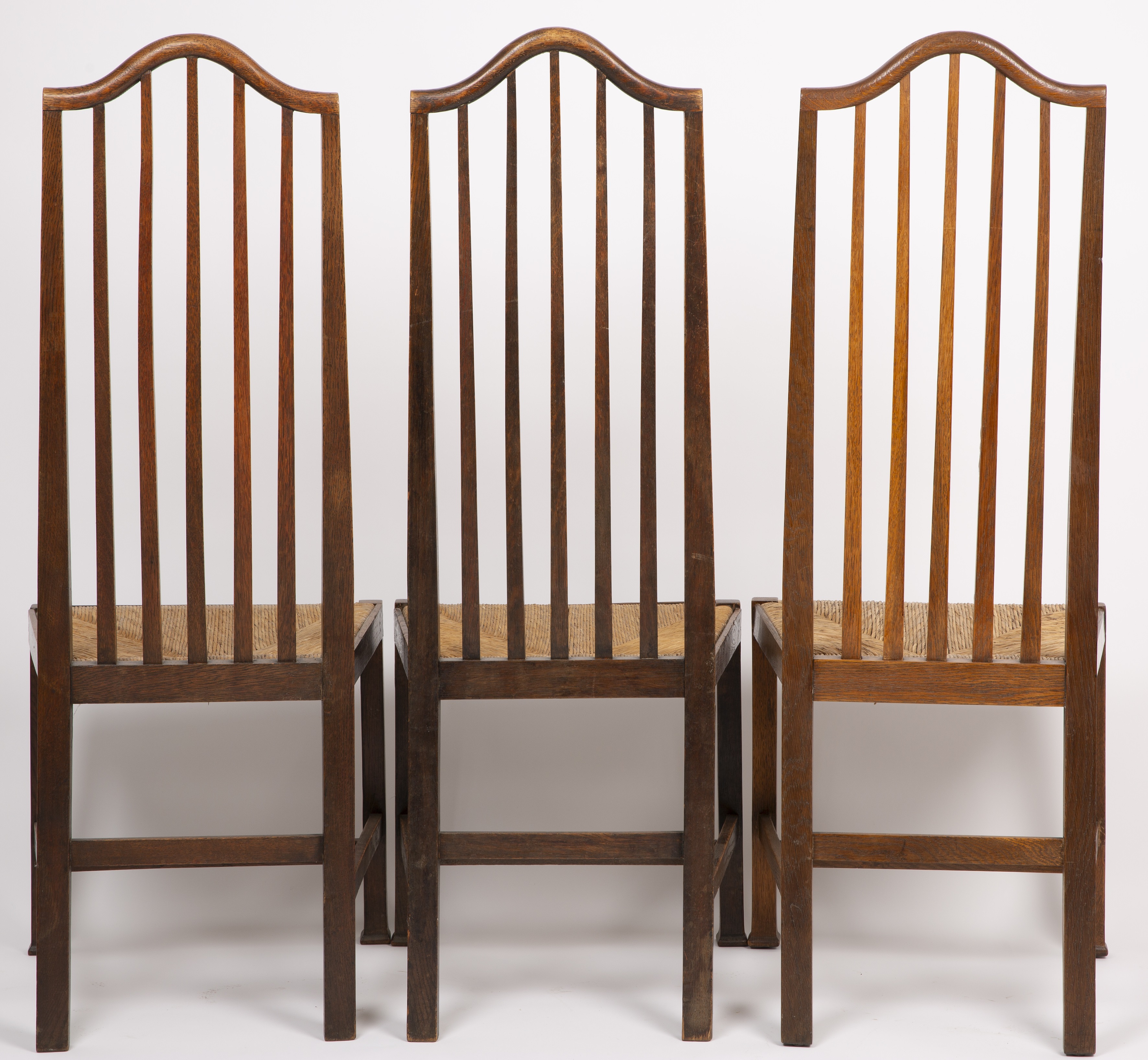 Arts & Crafts A set of six dining chairs, circa 1900 oak with rush seats 121cm high, 41cm wide (6). - Image 3 of 3