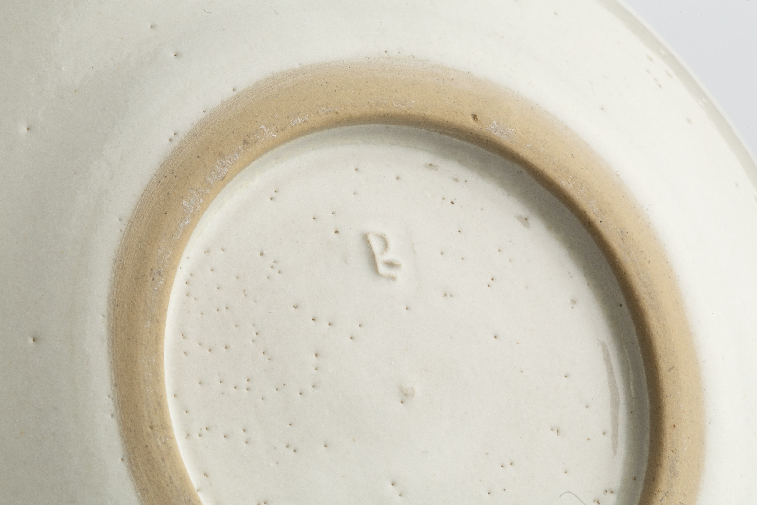 Lucie Rie (1902-1995) Dish cream glaze with manganese rim impressed potter's seal 14cm diameter. - Image 2 of 2