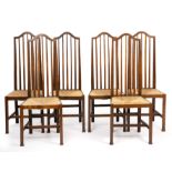 Arts & Crafts A set of six dining chairs, circa 1900 oak with rush seats 121cm high, 41cm wide (6).