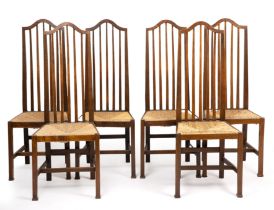 Arts & Crafts A set of six dining chairs, circa 1900 oak with rush seats 121cm high, 41cm wide (6).