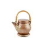 Sarah Walton (b.1945) Teapot and stand stoneware, with cane handle 13cm high (excluding handle); and
