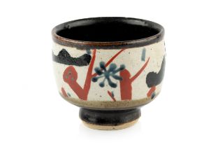 John Maltby (1936-2020) Footed bowl decorated with blue, red, and black abstract motifs on a cream