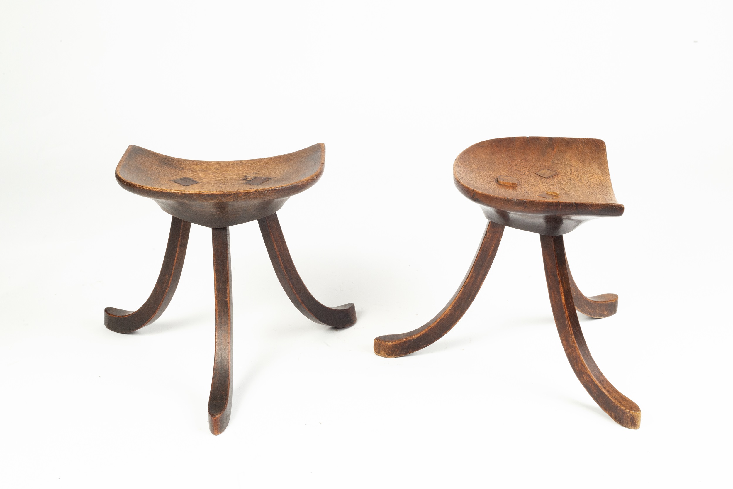 Liberty & Co. A pair of Thebes stools, circa 1910 oak, each with a dish seat over three swept legs - Image 2 of 4