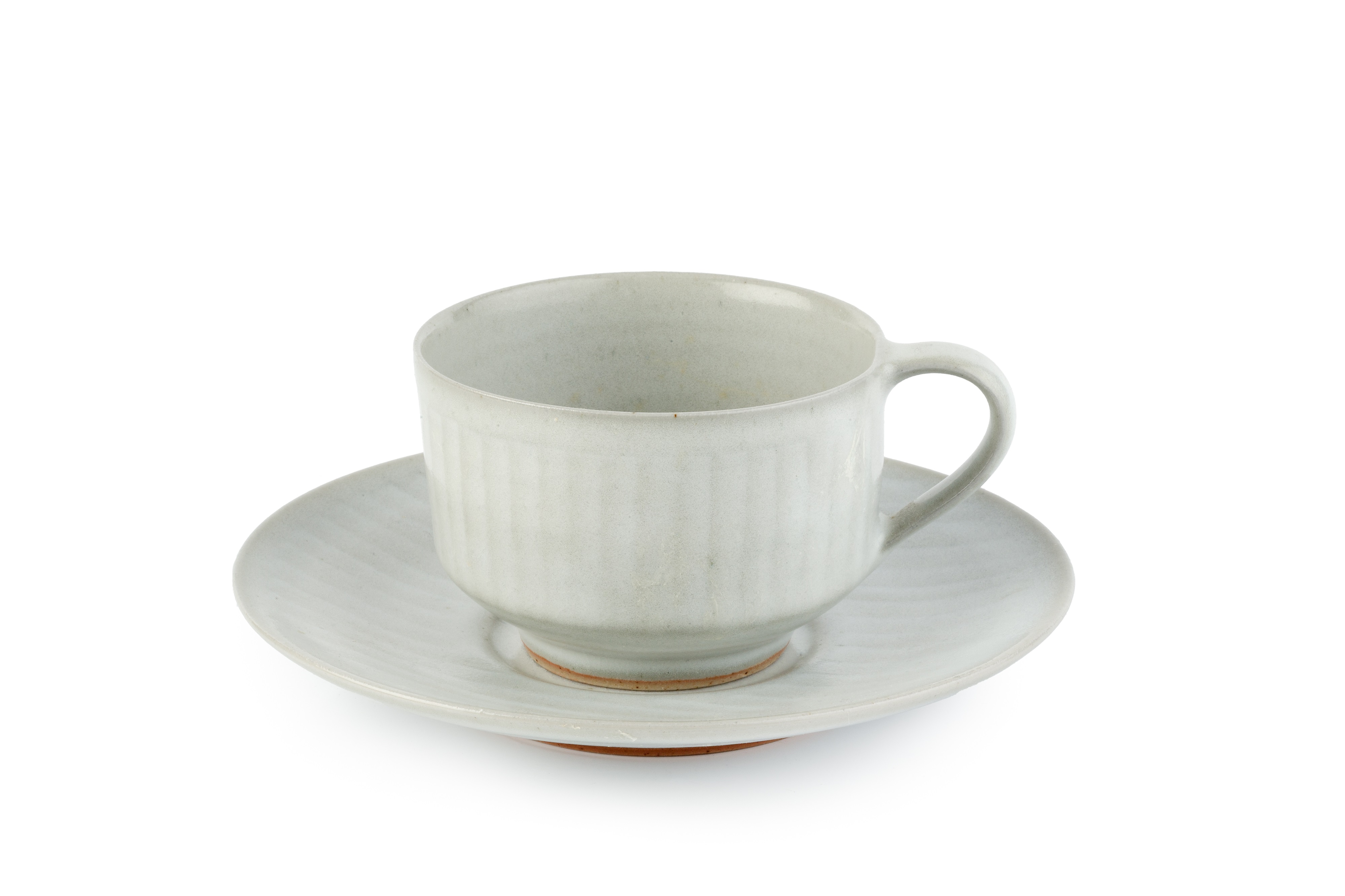 Rupert Spira (b.1960) Cup and saucer pale glaze and with a faint incised pattern both with impressed