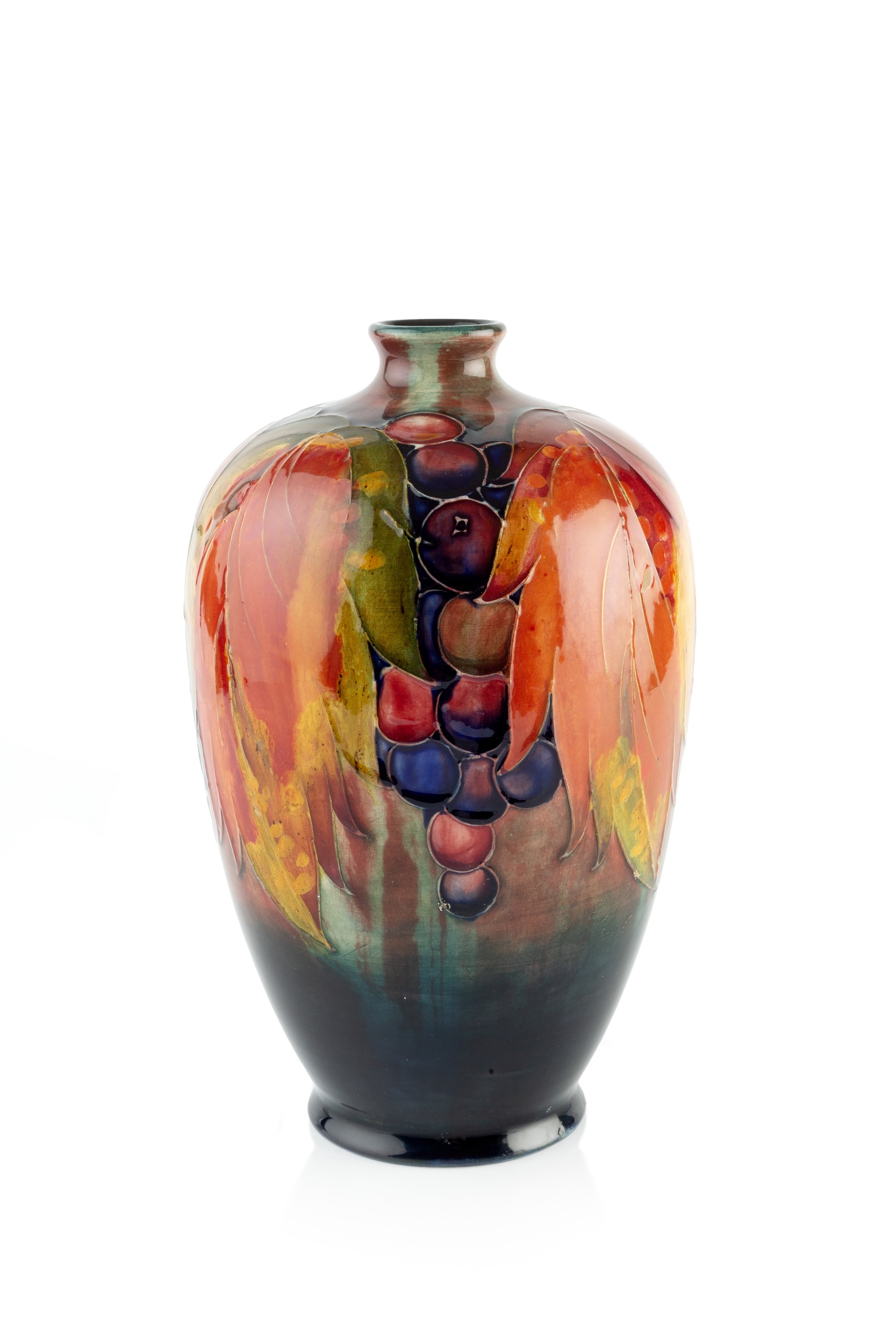 William Moorcroft (1872-1945) Vase leaf and berry pattern signed and with impressed marks 25cm high.