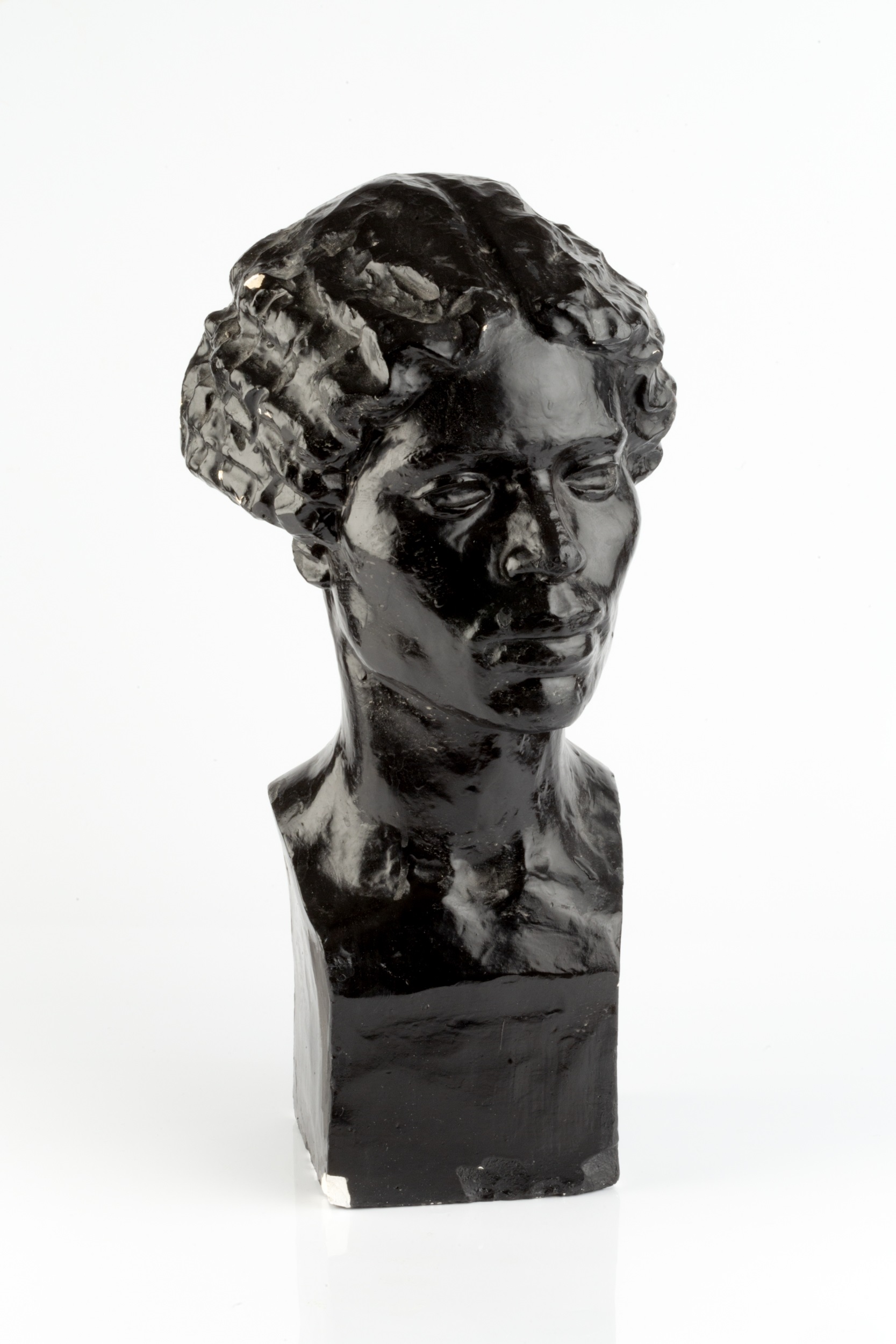 Manner of Jacob Epstein (1880-1959) Portrait bust of a girl, circa 1920 black painted plaster 49cm - Image 2 of 3