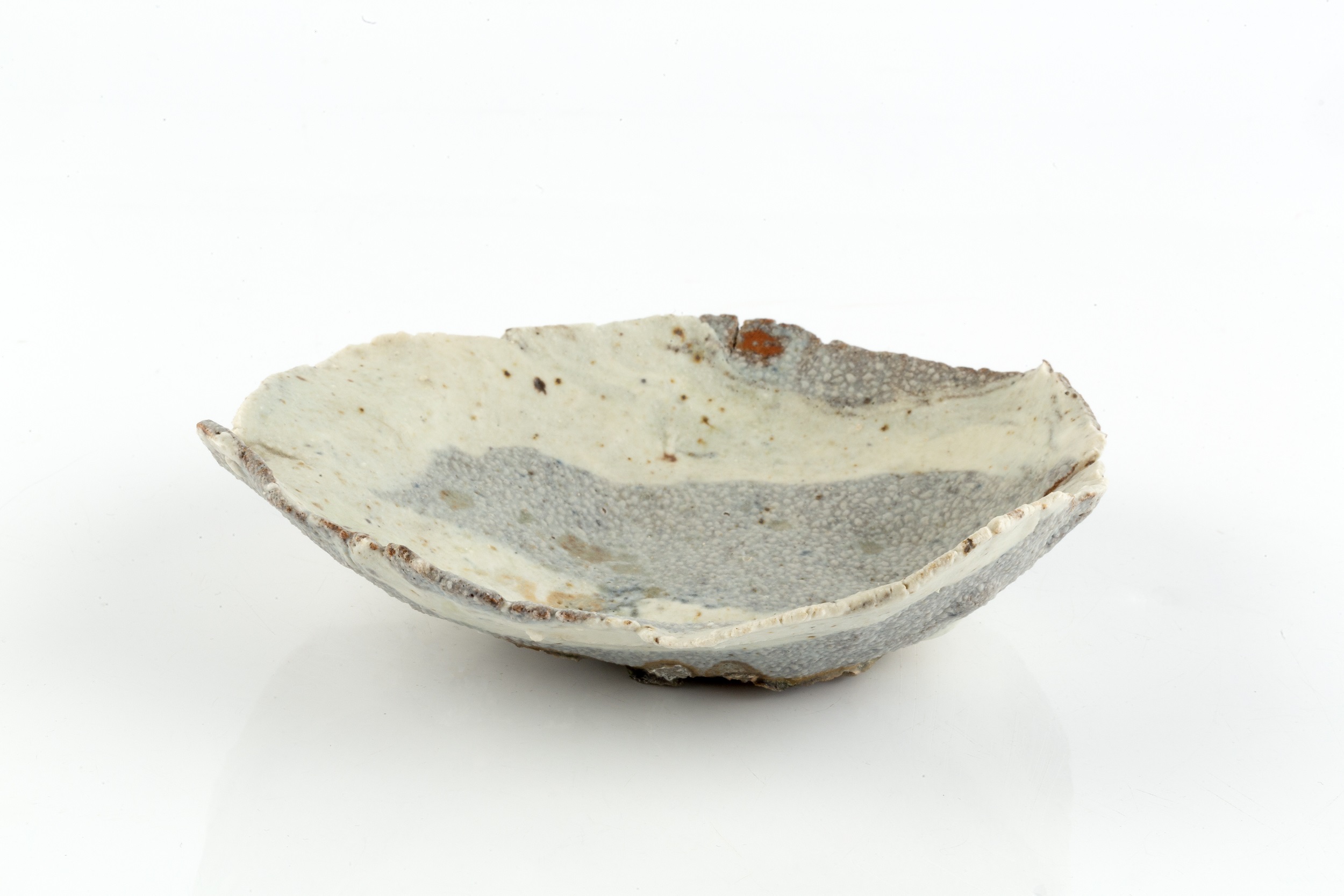 Ewen Henderson (1934-2000) An early dish with mixed cream and blue glaze 15cm wide. - Image 2 of 3