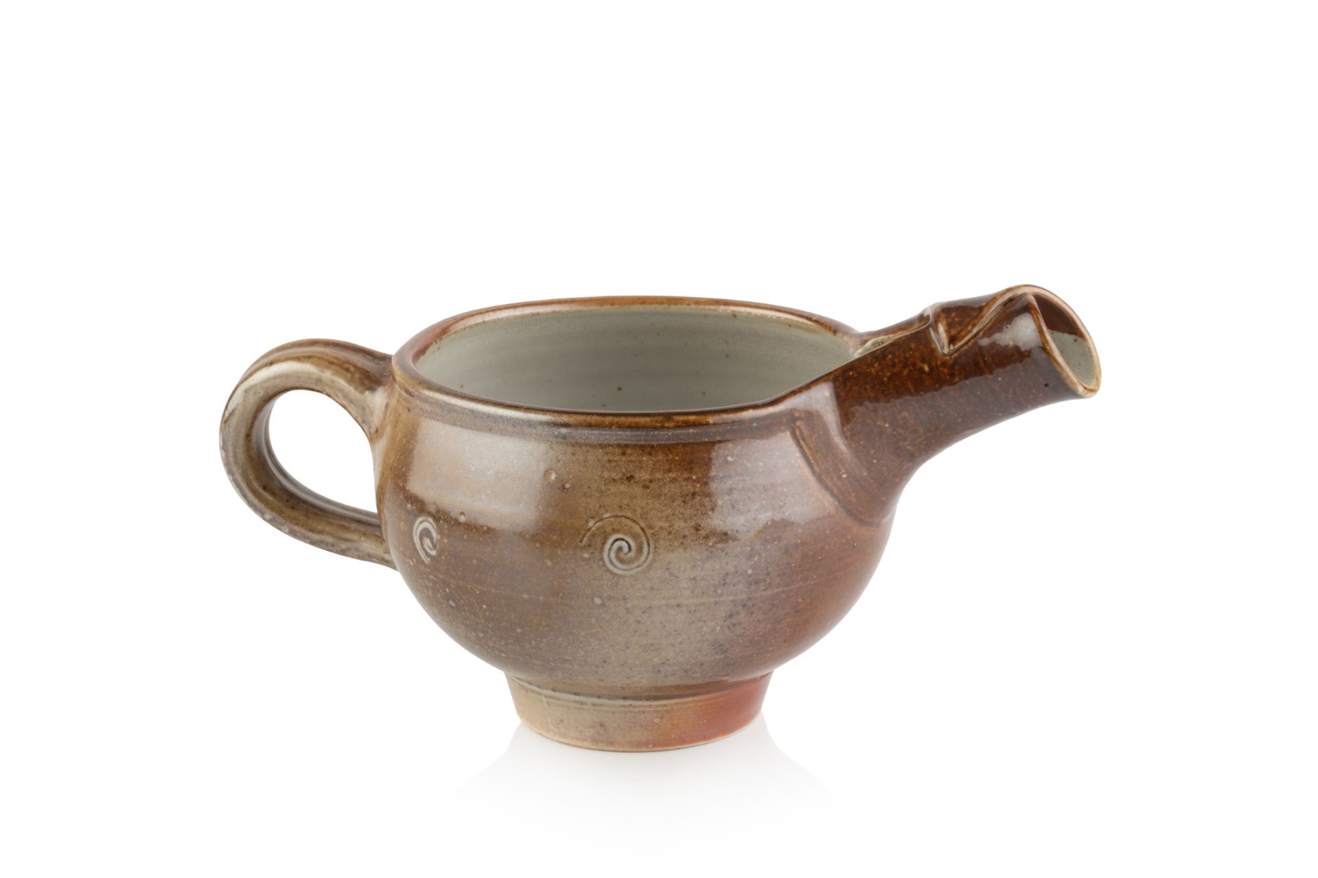 Sheila Casson (b.1930) Footed jug salt glaze and spiral motifs impressed potter's seal 12cm high,